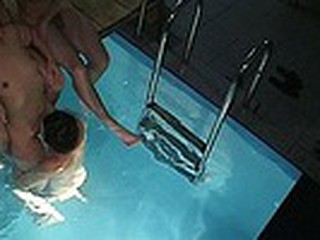 Spying in sauna is always worth the efforts! Enjoy the wild fuck session in the pool with the guy supporting lewd naked bimbo when his friend is wildly pumping her snatch with water slopping inside the hole!