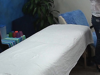 Blond girl takes off garments and underware slowly and then lies on massage table. Impressive masseur enters the room and this babe becomes turned on seeing him. The girlie makes a decision to entice him to fuck herЕ