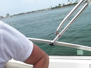 strumpets engulfing cock on a boat
